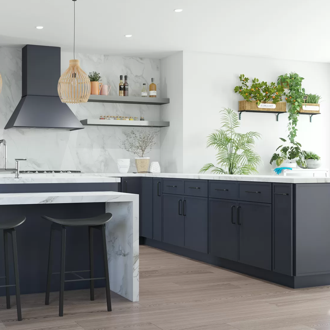 Contemporary kitchen featuring navy blue cabinetry, marble countertops, and hanging pendant lights.