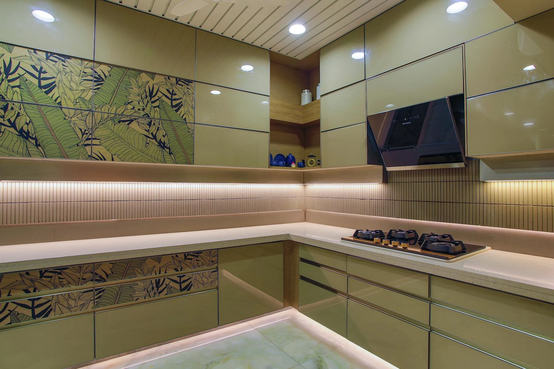 A modern kitchen featuring a wall of cabinets and an illuminated wall of lights, creating a bright and functional space.